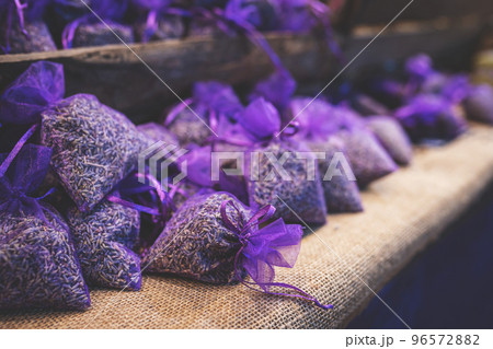 Lavender bud dry flower sachet fragrant bags, purple organza pouch with natural dried lavender flowers at market. Toned image with selective soft focus and copy space. 96572882