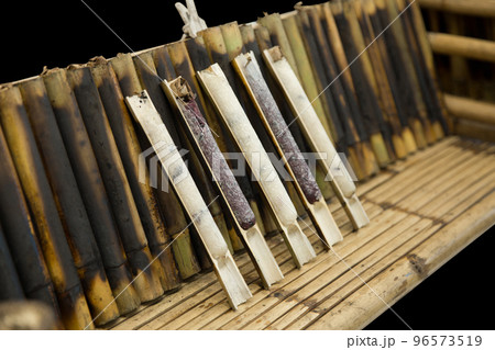 Baked Sticky Rice in Bamboo on wood, focus selective 96573519