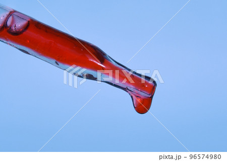 The drop in the pipette of blood. The concept of developing a pharmaceutical drug for the treatment of diseases with the help of drugs that improve DNA. High quality photo 96574980