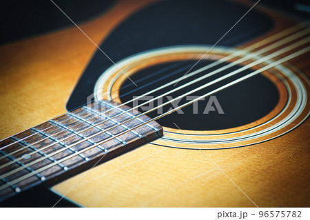 Acoustic guitar with new strings 96575782