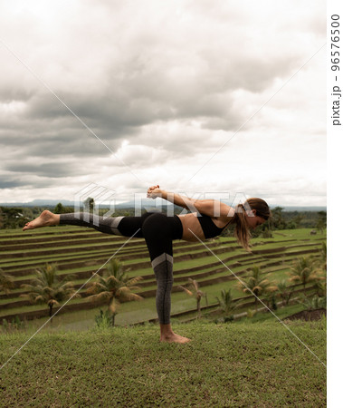 girl doing yoga outdoors girl doing yoga outdoors 96576500