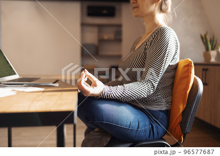 Stress relief during freelance work. Brunette woman freelancer Stress relief during freelance work. Brunette woman freelancer 96577687