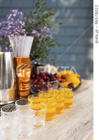 Glasses of cocktails on the bar. Glasses of sparkling wine with red alcohol. Glasses of cocktails on the bar. Glasses of sparkling wine with red alcohol. 96578022