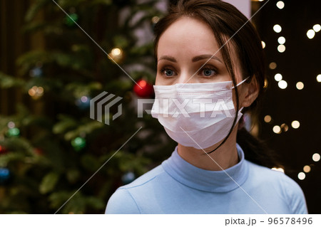 female portrait in medical mask on bokeh background 96578496
