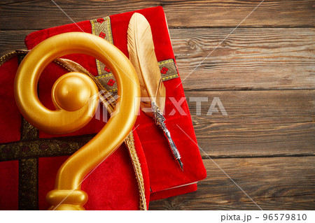 6th december Saint Nicholas Day - Sinterklaas. St Nicholas mitre and book on wooen table 6th december Saint Nicholas Day - Sinterklaas. St Nicholas mitre and book on wooen table 96579810