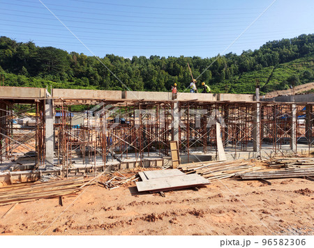 MELAKA, MALAYSIA - MARCH 4, 2021: The building structure is made of reinforced concrete still under construction. This reinforced concrete mold is made of timber and plywood formwork. 96582306