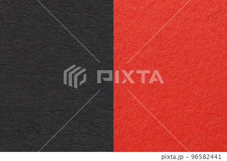 Texture of craft black and red paper background, half two colors, macro. Structure of vintage scarlet cardboard. Texture of craft black and red paper background, half two colors, macro. Structure of vintage scarlet cardboard. 96582441