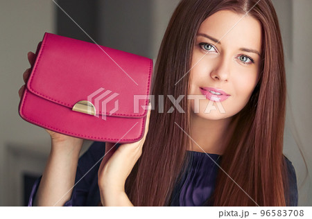 Fashion and accessories, happy beautiful woman holding small pink handbag with golden details as stylish accessory and luxury shopping concept Fashion and accessories, happy beautiful woman holding small pink handbag with golden details as stylish accessory and luxury shopping concept 96583708