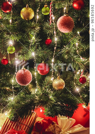 Christmas gifts and festive holiday presents, classic xmas gift boxes under decorated christmas tree, happy holidays and boxing day celebration theme 96585692