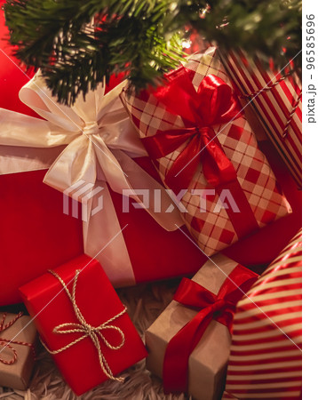 Christmas gifts and festive holiday presents, classic xmas gift boxes under decorated christmas tree, happy holidays and boxing day celebration theme Christmas gifts and festive holiday presents, classic xmas gift boxes under decorated christmas tree, happy holidays and boxing day celebration theme 96585696