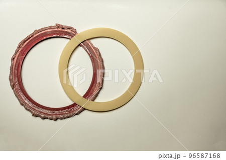 Old and new seal gasket from the flapper mechanism of a leaky residential bathroom toilet 96587168