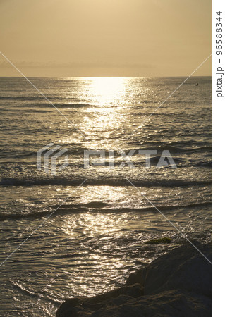 Reflections of the sun in the sea at sunrise 96588344