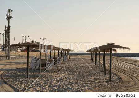 Parasols and hammocks on the beach, 96588351
