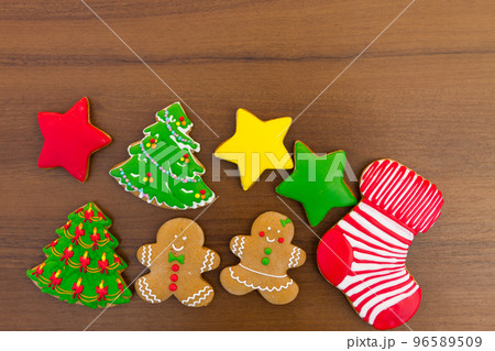 Festive tasty Christmas cookies on wooden table. Top view 96589509