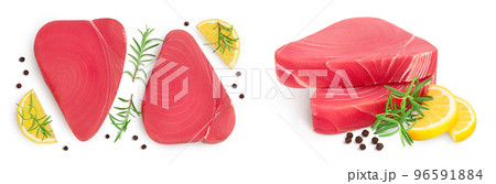 Fresh tuna fish fillet steak with rosemary, lemon and peppercorns isolated on white background with . Top view. Flat lay 96591884