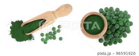 Spirulina algae powder and pills in wooden scoop isolated on white background. Top view 96591920