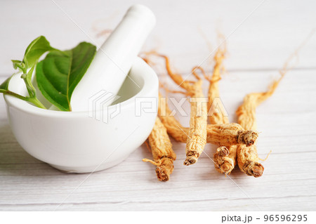 Ginseng roots and green leaf, healthy food. Ginseng roots and green leaf, healthy food. 96596295