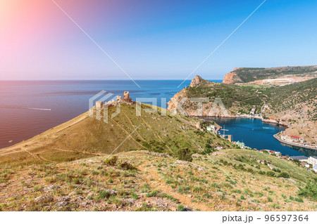 Scenic panoramic view of Balaclava bay with yachts from the ruines of Genoese fortress Chembalo. Balaklava, Sevastopol, Crimea. Inspirational travel landscape. Aerial photo. Copy space. Scenic panoramic view of Balaclava bay with yachts from the ruines of Genoese fortress Chembalo. Balaklava, Sevastopol, Crimea. Inspirational travel landscape. Aerial photo. Copy space. 96597364