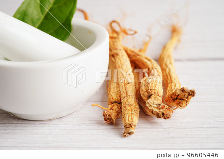 Ginseng roots and green leaf, healthy food. Ginseng roots and green leaf, healthy food. 96605446