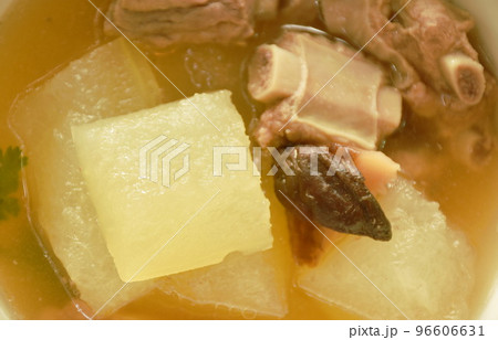 boiled winter melon with pork bone and black mushroom soup on bowl boiled winter melon with pork bone and black mushroom soup on bowl 96606631