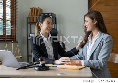 Justice and attorney concept. Lawyer meeting and consoling solution to his client provide legal advice and trust commitment strain serious for problem 96606763