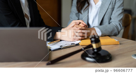 Justice and attorney concept. Lawyer meeting and consoling solution to his client provide legal advice and trust commitment strain serious for problem 96606777