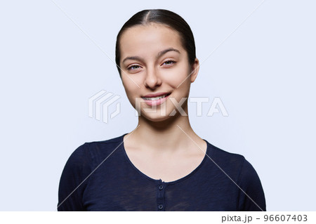 Portrait of teenager girl looking at camera on white background Portrait of teenager girl looking at camera on white background 96607403