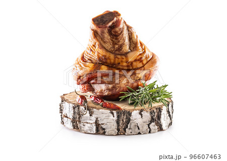Smoked pork Bavarian knee with rosemary and chili peppers on birch wood - isolated on white Smoked pork Bavarian knee with rosemary and chili peppers on birch wood - isolated on white 96607463