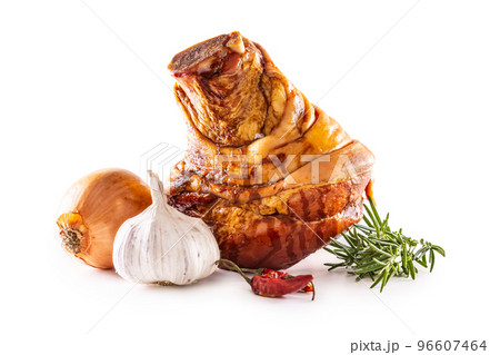 Smoked pork bavarian knee with rosemary chili peppers onion and garlic isolated on white background Smoked pork bavarian knee with rosemary chili peppers onion and garlic isolated on white background 96607464