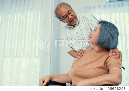 A contented senior couple and their in-home nurse. A contented senior couple and their in-home nurse. 96608203