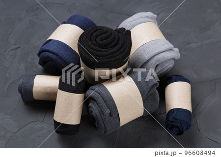 Pile of men's rolled up socks lies on concrete Pile of men's rolled up socks lies on concrete 96608494