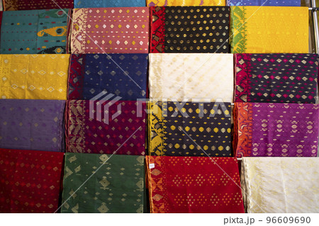Bangladeshi Women,s Traditional Colorful Jamdani saree hanging in the retail Showrooms. Colorful Jamdani Saree Texture Background 96609690