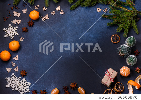 Delicious festive New Year's pie with candied fruits, marzipan and nuts on a dark concrete background 96609970