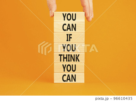 You can symbol. Concept words You can if you think you can on wooden blocks on a beautiful orange table orange background. Businessman hand. Business motivational and you can concept. You can symbol. Concept words You can if you think you can on wooden blocks on a beautiful orange table orange background. Businessman hand. Business motivational and you can concept. 96610435