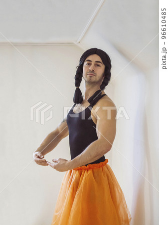 Young muscular man pretending to be a ballerina Young muscular man pretending to be a ballerina 96610485