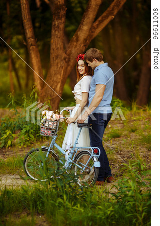 Loving couple on vintage bike 96611008