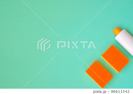 Cleaning products on green background. Detergent, sponges and brush. Service concept. Flat lay. Copy space. Cleaning products on green background. Detergent, sponges and brush. Service concept. Flat lay. Copy space. 96611542