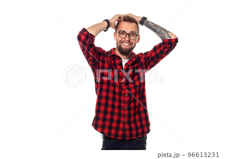 Handsome man model studio portrait. Boy casual style, trendy hipster in checkered shirt look with cool hairstyle 96613231