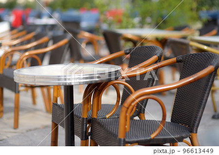 An empty stylish street cafe in a European city. Cozy outdoor restaurant. 96613449