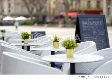An empty stylish street cafe in a European city. Cozy outdoor restaurant. 96613451
