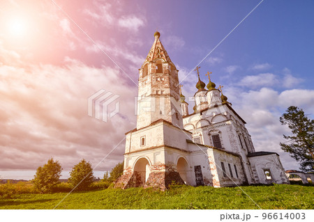 Old orthodox church at village. Summer view with floral meadow. Sun flare 96614003