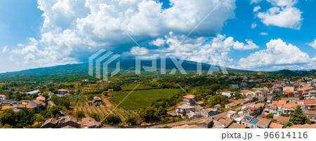 Panoramic aerial wide view of the active volcano Etna, extinct craters on the slope, traces of volcanic activity Panoramic aerial wide view of the active volcano Etna, extinct craters on the slope, traces of volcanic activity 96614116