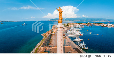 Messina, Sicily, Italy, August 20, 2022. View of the Messina's port with the gold Madonna della Lettera statue 96614135