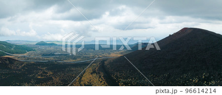 Panoramic aerial wide view of the active volcano Etna, extinct craters on the slope, traces of volcanic activity 96614214