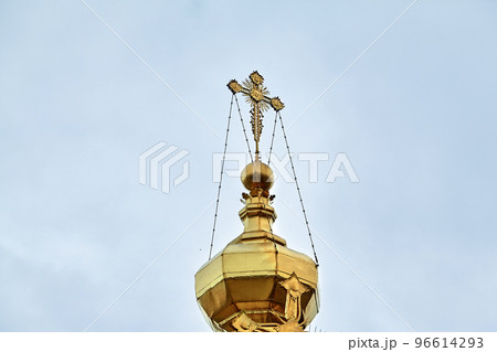 Eastern orthodox crosses on gold domes, cupolas, against blue sky with clouds Eastern orthodox crosses on gold domes, cupolas, against blue sky with clouds 96614293