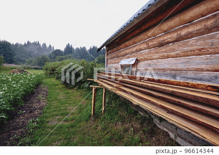 Front view of wooden house in russian village in sunny summer day 96614344
