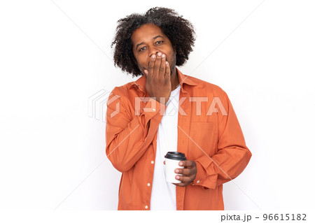 Portrait of surprised mid adult man covering mouth Portrait of surprised mid adult man covering mouth 96615182