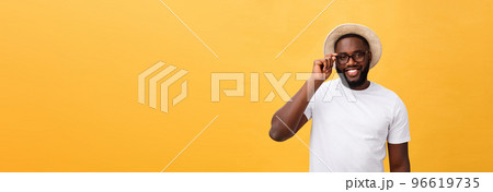 Close up portrait of young afro american shocked tourist , holding his eyewear, wearing tourist outfit, hat, with wide open eyes Close up portrait of young afro american shocked tourist , holding his eyewear, wearing tourist outfit, hat, with wide open eyes 96619735