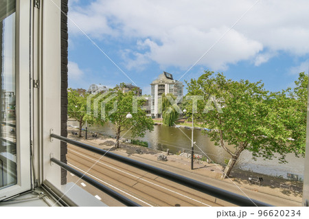 Plastic window and radiator on white wall in empty light room at home 96620234