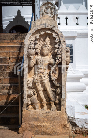 Guard stone in Thuparama temple entrance, snake god and two dwarfs carved in one stone. 96621940